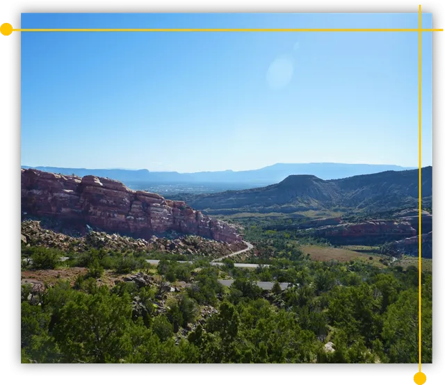 A picture of a valley with mountains in Western Colorado A picture of a valley with mountains in Western Colorado