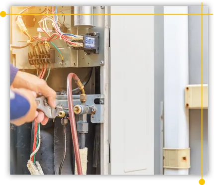 A person is working on an air conditioner with a wrench. A person is working on an air conditioner with a wrench.