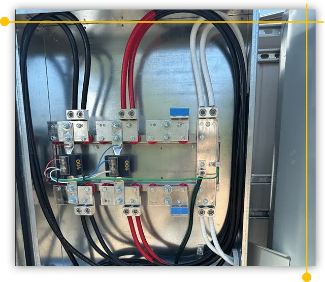 A metal box filled with electrical wires and connectors A metal box filled with electrical wires and connectors