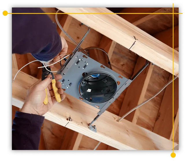 A person is working on a light fixture in the ceiling of a house. A person is working on a light fixture in the ceiling of a house.