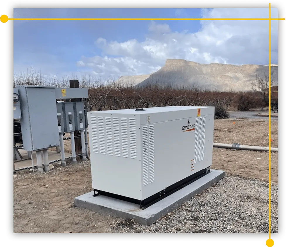 A large white generator is sitting in the middle of a dirt field. A large white generator is sitting in the middle of a dirt field.